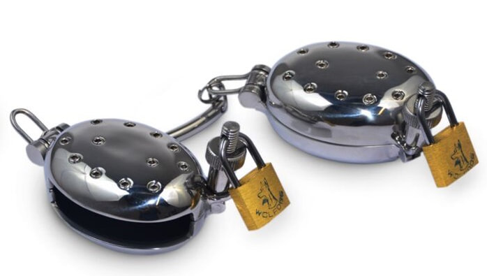 A cock cage a.k.a a chastity belt used in female domination for ball torture and orgasm denial.